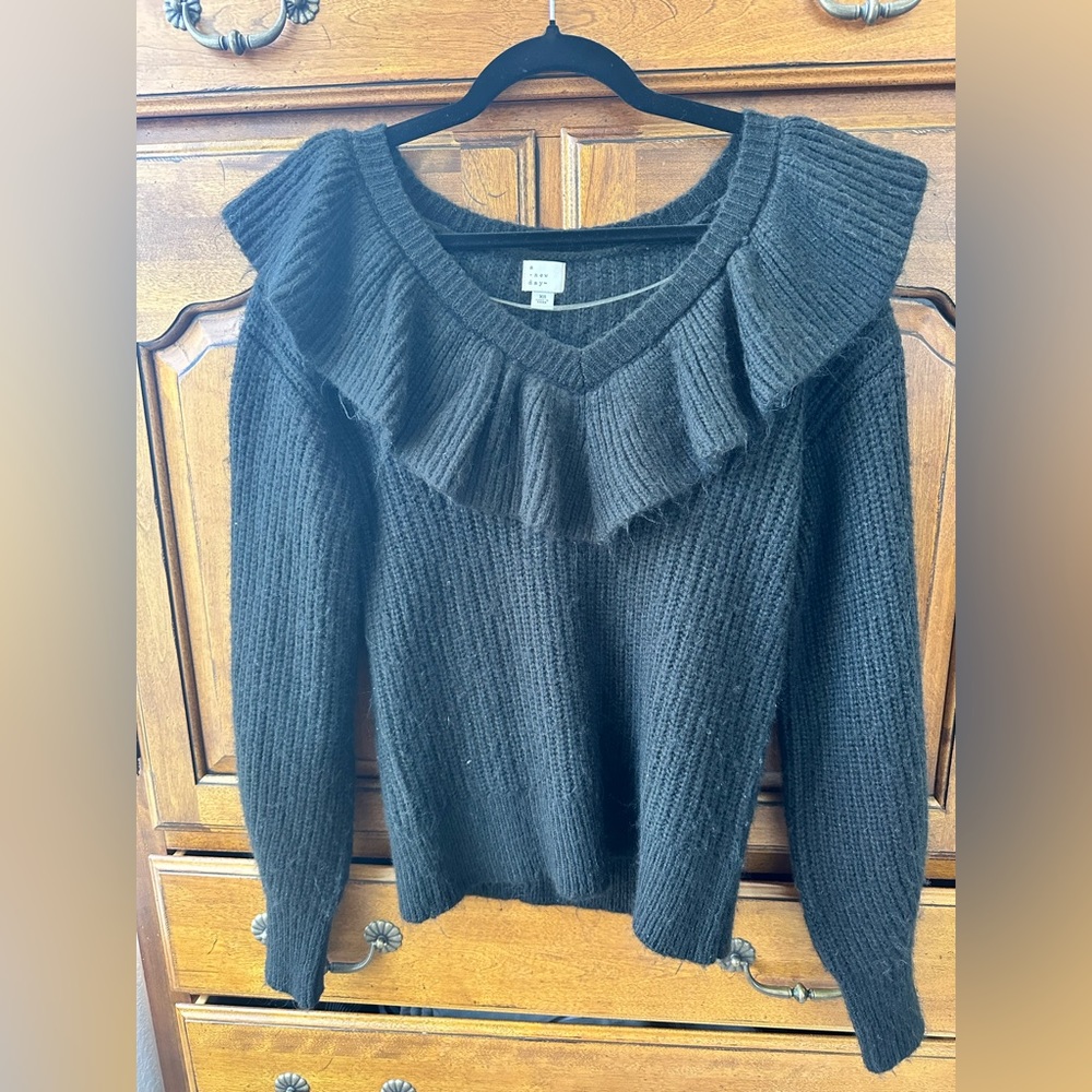 Off the shoulder ruffled sweater